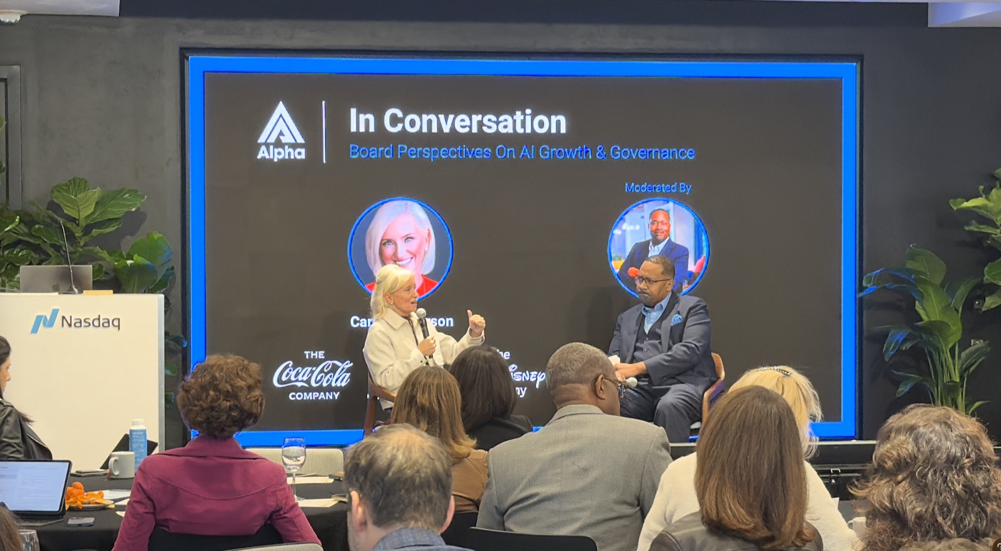 Two leaders in conversation before an audience at an Alpha convening.